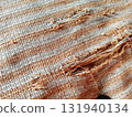Torn fabric. Frayed cloth background for sample, presentation, safety issue, excessive acid wash warning etc 131940134