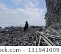 Man in a helmet on the beach in winter 131941009