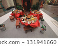 Oct 4 2025 Miniature Table Set With Assorted Dishes, Bottles, And Red Tablecloth 131941660