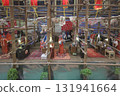 Oct 4 2025 Miniature Model Of A Community Event With Red Banner, 131941664