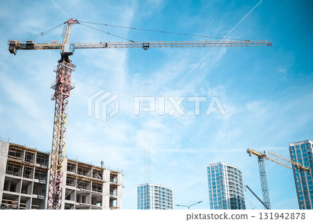 Construction crane in the construction of multi-storey buildings 131942878