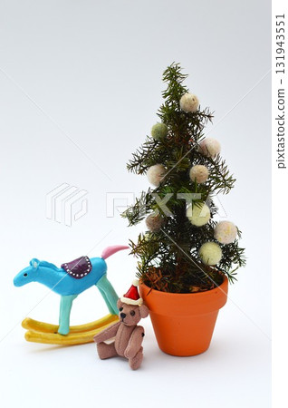 Small Christmas tree, teddy bear and rocking horse Small Christmas tree, teddy bear and rocking horse 131943551