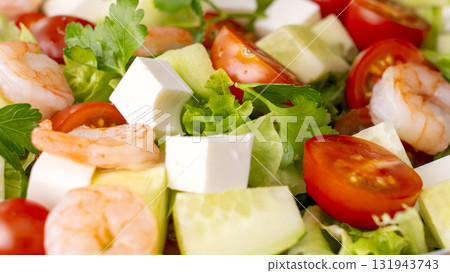 A close-up of a vegetable salad with shrimp. Fresh vegetables, feta cheese, and shrimp make for a healthy meal. A close-up of a vegetable salad with shrimp. Fresh vegetables, feta cheese, and shrimp make for a healthy meal. 131943743