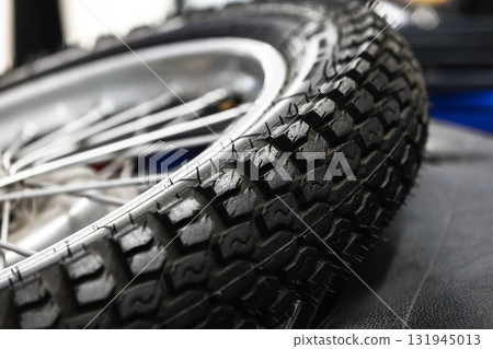 A detailed close-up view of a motorcycle spare wheel A detailed close-up view of a motorcycle spare wheel 131945013