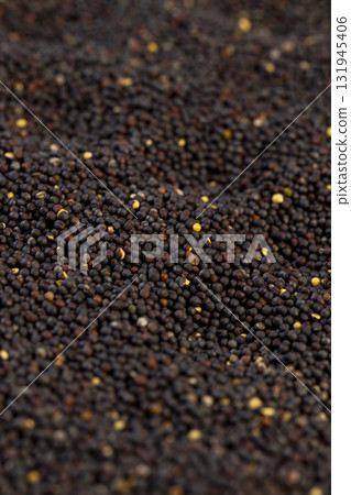 a large number of black rapeseed seeds are used to produce rapeseed oil, close up, black rapeseed is used to produce food products a large number of black rapeseed seeds are used to produce rapeseed oil, close up, black rapeseed is used to produce food products 131945406