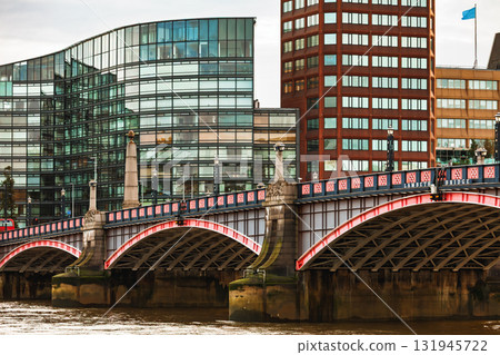 Lambeth Bridge and modern office buildings along the River Thames in London Lambeth Bridge and modern office buildings along the River Thames in London 131945722