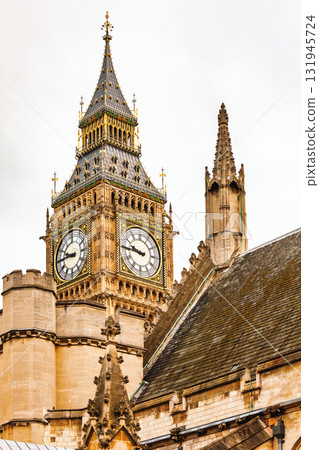 Elizabeth Tower clock face and ornate Gothic details in London Elizabeth Tower clock face and ornate Gothic details in London 131945724