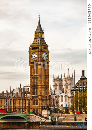 Vertical view of Elizabeth Tower and Palace of Westminster with Westminster Bridge over River Thames in London Vertical view of Elizabeth Tower and Palace of Westminster with Westminster Bridge over River Thames in London 131945729