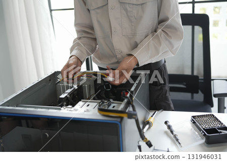 Computer hardware technician fixing and assemble computer PC. Computer hardware technician fixing and assemble computer PC. 131946031