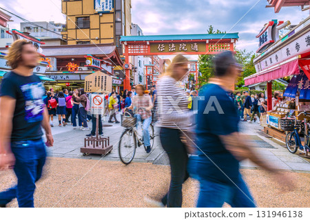 Tokyo cityscape in Japan: View of Denpoin Street and Nakamise Street, bustling with foreign tourists. Dangerous cyclists are rampant. Tokyo cityscape in Japan: View of Denpoin Street and Nakamise Street, bustling with foreign tourists. Dangerous cyclists are rampant. 131946138