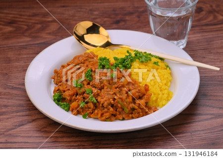 Homemade dry curry with minced beef and pork, onions and peppers (turmeric rice) Homemade dry curry with minced beef and pork, onions and peppers (turmeric rice) 131946184