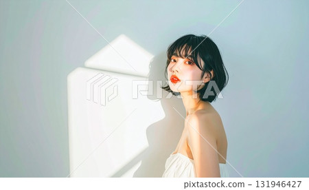 A portrait of a Japanese woman (in her 20s, elegant, beautiful skin) shining with light reflections and lens flares 131946427