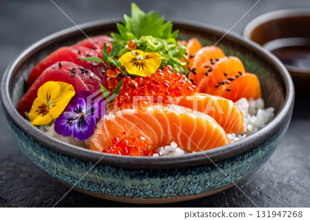 Colorful poke bowl with fresh salmon, tuna, and edible flowers Colorful poke bowl with fresh salmon, tuna, and edible flowers 131947268
