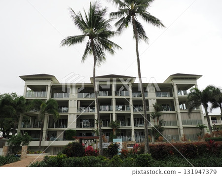 Palm Cove Inn – White Building Surrounded by Palms Palm Cove Inn – White Building Surrounded by Palms 131947379