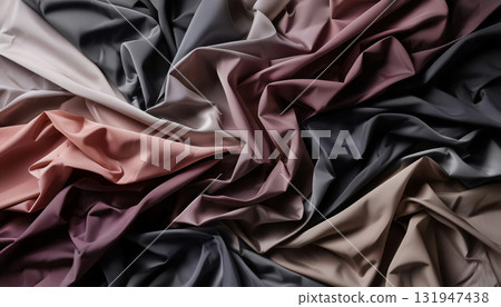 The abstract background is a draped fabric with dense, chaotic folds and contrasting trim. The glossy material creates a complex, three-dimensional pattern. The abstract background is a draped fabric with dense, chaotic folds and contrasting trim. The glossy material creates a complex, three-dimensional pattern. 131947438