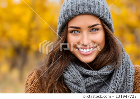 Young woman smiling outdoors during autumn weather 131947722