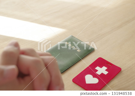A man looking at his disability certificate A man looking at his disability certificate 131948538