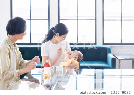 A couple holding a baby A couple holding a baby 131949022