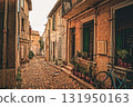 Cobblestones and old houses in Arles 131950163