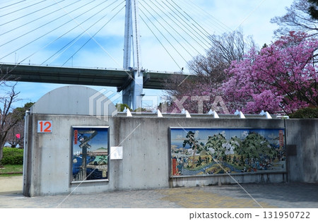 Tempozan Park (Minato Ward, Osaka City) during cherry blossom season: A concrete wall in the park designed with ukiyo-e art 131950722