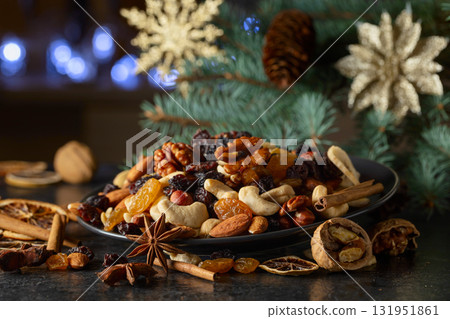 Dried tropical fruits with various nuts and raisins. 131951861