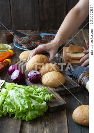 Chef preparing burger  with fresh ingredients 131952634