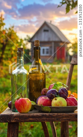Fresh fruit still life with grapes, apples, and a bottle of olive oil 131952880