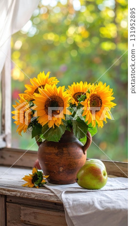 A beautiful yellow sunflower bouquet in a glass vase is a vibrant summer nature arrangement 131952895