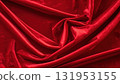 Shiny red satin fabric with soft, smooth waves creates a luxurious, elegant, and passionate textile texture, perfect for a Christmas or Valentine's backdrop 131953155