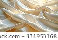 Soft white silk satin fabric with a delicate pink rose and smooth, luxury folds texture background 131953168