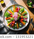 A colorful salad beautifully presented on a simple white plate 131953221