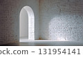 Arched doorway in a white brick wall, bathed in light, with a neutral floor, creating a serene and minimalist architectural space. 131954141
