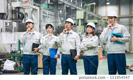Group of workers thinking in a factory 131954547