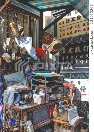 Sept 27 2025 Cluttered Old Workshop With Tools, Shoes, and Chinese Signage 131955208