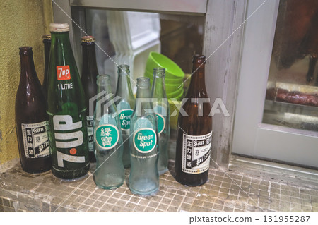 Sept 27 2025 Assorted Glass Bottles On Window Sill Featuring Green Spot Sept 27 2025 Assorted Glass Bottles On Window Sill Featuring Green Spot 131955287