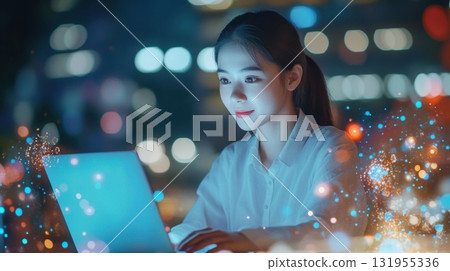 Woman working late on laptop at night. Woman working late on laptop at night. 131955336