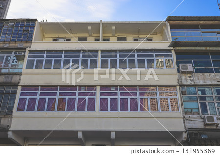 Sept 27 2025 Old Urban Building Facade With Glass Windows And Weathered Concrete 131955369