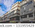 Sept 27 2025 Old Urban Building Facade With Glass Windows And Weathered Concrete 131955429