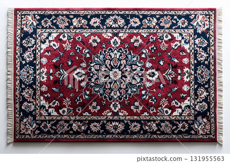 Handwoven Persian rug texture on a white background. Top view. 131955563