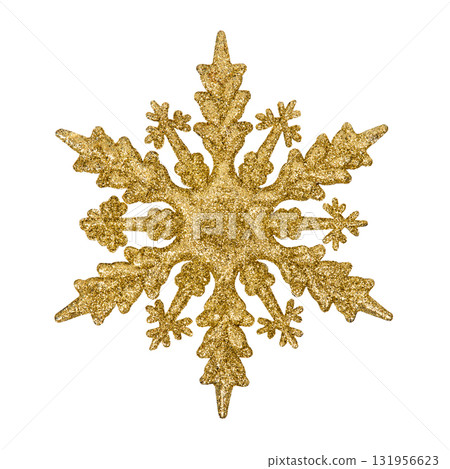 A Christmas decorative tree ornament in the shape of a golden shiny snowflake, isolated on a white background with clipping path. Design element for Christmas card 131956623