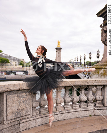 Ballet dancer performing on Paris bridge  131956641