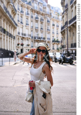 Stylish woman walking on Paris street in summer  131956659
