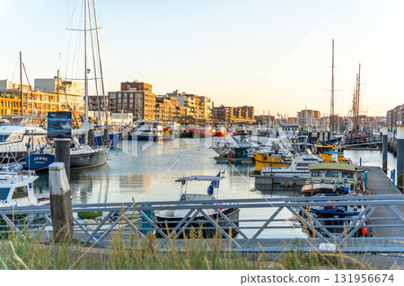 Yacht harbor illuminated by the setting sun Yacht harbor illuminated by the setting sun 131956674