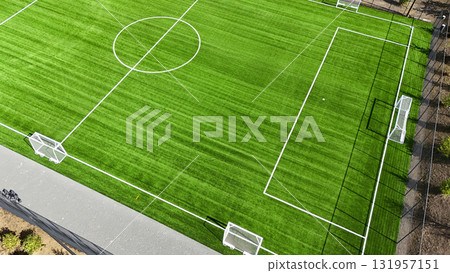 A soccer field with a white line in the middle A soccer field with a white line in the middle 131957151