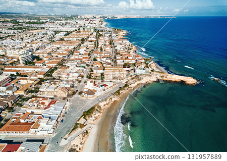 Aerial view of Mediterranean coastal town in Spain Aerial view of Mediterranean coastal town in Spain 131957889