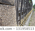 Tranquil, historic Japanese stone wall and old wooden fence with bamboo detail. perspective showcases ancient architecture, traditional material, and enduring culture of Japan 131958513
