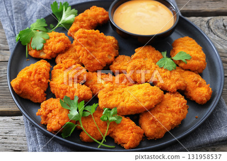 breaded chicken breast chunks with dipping sauce breaded chicken breast chunks with dipping sauce 131958537