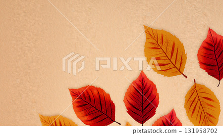The soft red leaves and yellow and gold leaves gently decorate the edges, creating a background that evokes the warmth and harmony of autumn. 131958702