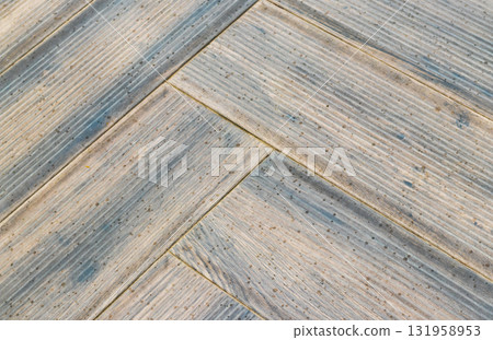 Wooden pool deck with rain drops on it 131958953