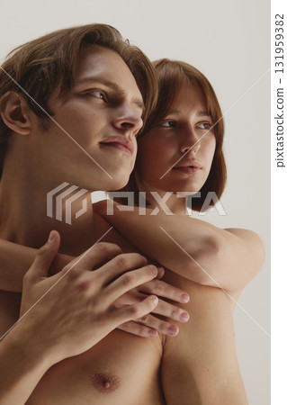 Couple embracing softly with serene confidence and natural beauty glow 131959382